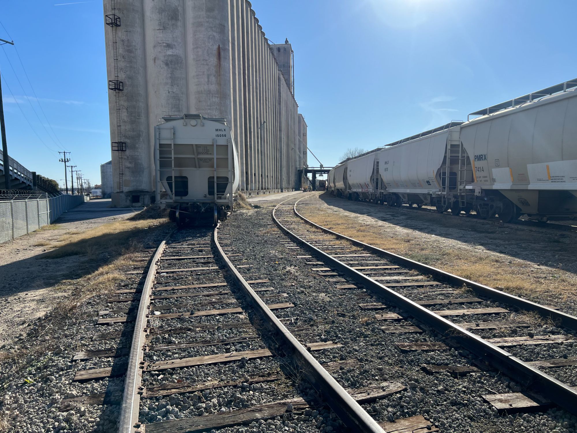 Sidings curving past the silos